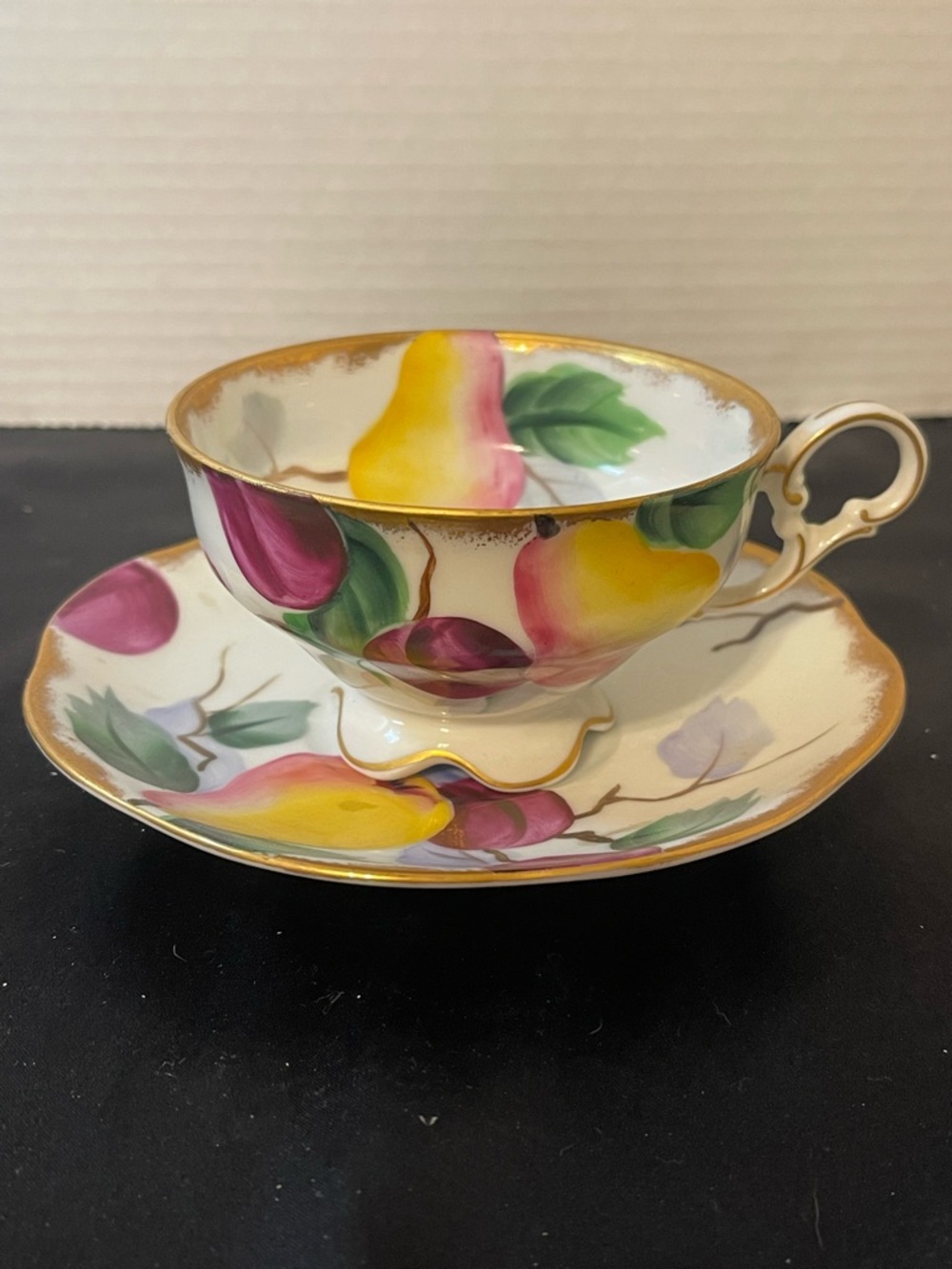Hand-Painted Teacup and Saucer with Yellow and Pink Fruit Motif